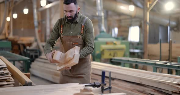 Man Working with Wood at the Joinery