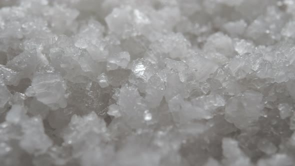 Crystals of white sea coarse salt. Extreme close up