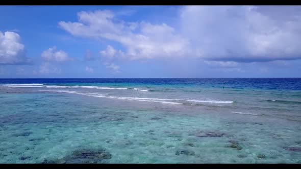 Aerial panorama of relaxing tourist beach voyage by blue water with white sand background of a dayou