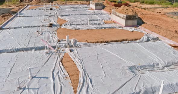 Plastic Water Pipes Industrial Pipeline Laid on Sand Foundation at Construction Site