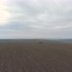 Flying Over Farmland Against Cloudy Sky - VideoHive Item for Sale
