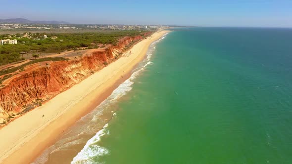 Drone flight over unique Praia de Falesia in Algarve region in Portugal 