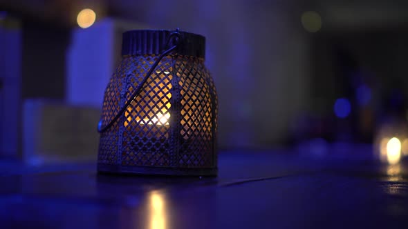 Beautiful Oriental Arabian Candle Lit Perforated Lamp On Corridor With Evening Blue Ambiant