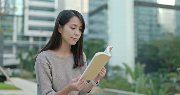 Woman read book at outdoor