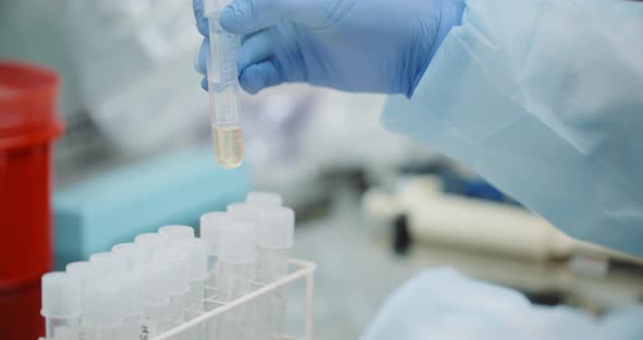 Female Scientist Doing Experiment in Laboratory alt