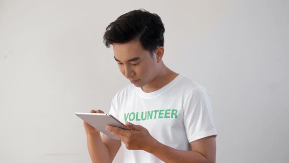 Male Volunteer with Tablet