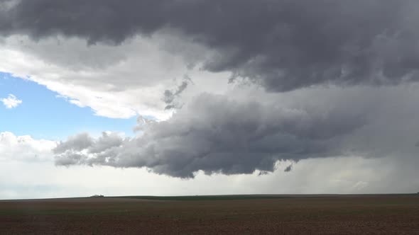 Clouds spinning over farmland in Colorado during tornado warning
