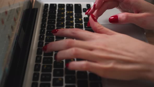 Girl hands typing on laptop 
