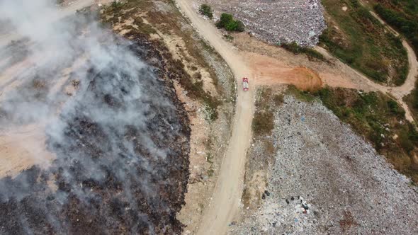 Aerial view fire engine move at the path go to save fire