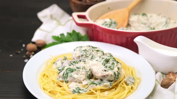 Portion of Delicious Meatballs with Spinach in a Creamy Sauce