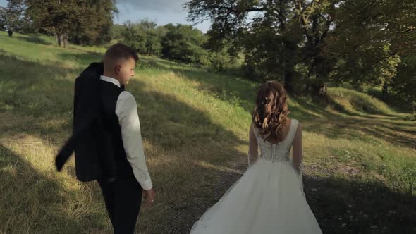 Groom with Bride Walking in the Park, Wedding Couple, Happy Family, Newlyweds