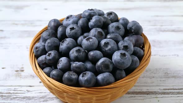 Basket with fresh picked healthy blueberries close up  