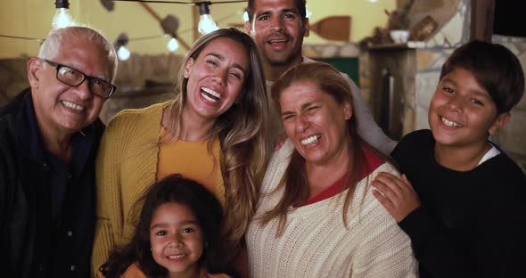 Happy latin family smiling on camera