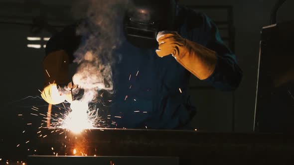 Metal Welder Working with Arc Welding Machine