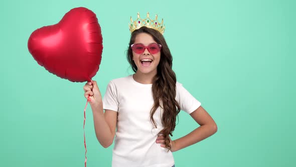 Happy Dancing Child in Princess Crown with Heart Party Balloon Show Peace Gesture Fun Time
