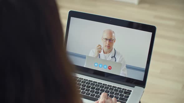 Patient Having Online Video Conference with Therapist Via Laptop