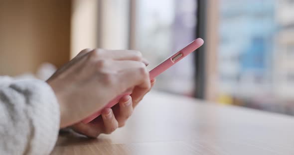 Woman Use of Cellphone at Coffee Shop