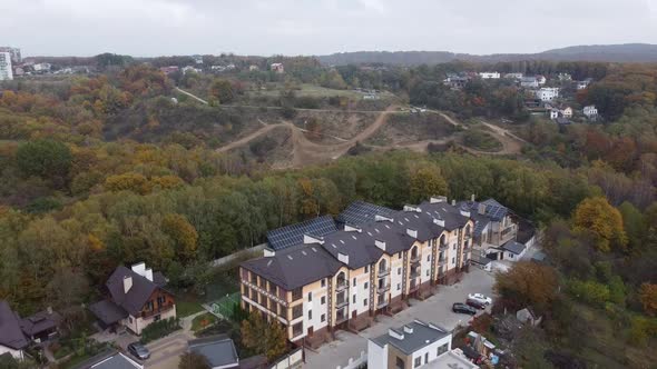 Drone Flying Over the Apartment Building and Forest 4