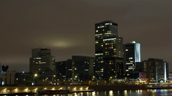 Time Lapse. Office Buildings in the City Center Near the River