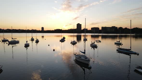 aerial view of boats at the lake during sunset, golden hour in minneapolis, minnesota during summer