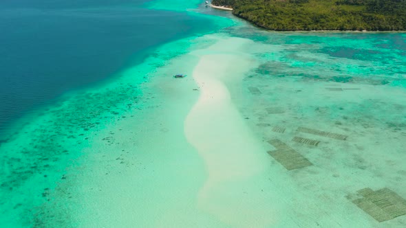 Sandy Beach in the Lagoon with Turquoise Water