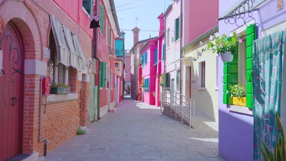 Street Between Old Bright Colored Houses with Flowers