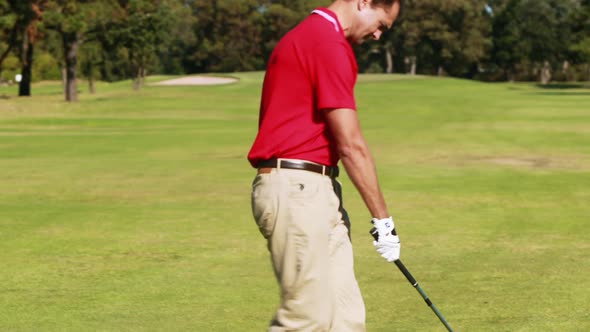 Golfer playing golf