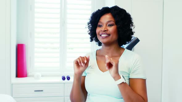 Woman performing stretching exercise at home 4k