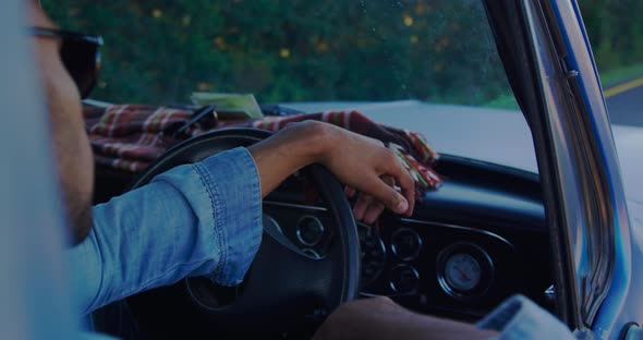 Young man on a road trip in pick-up truck