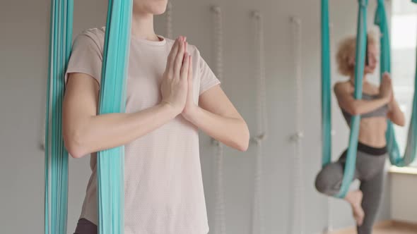 Caucasian Woman in Aerial Yoga Class