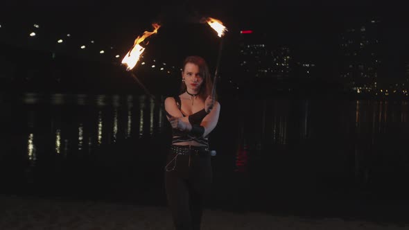 Firegirl Transfering To Viewer Energy of Fire at Night