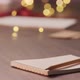 Closeup Man Place Pencil on Notepad with Shopping List for Holidays Under Warm Light in the Evening - VideoHive Item for Sale