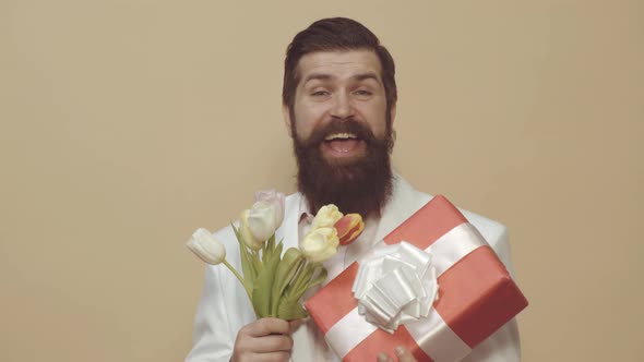Happy Man with Bouquet of Tulips for Holiday Celebration