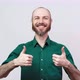 Happy bearded man showing thumbs up sign over white background. Good job. - VideoHive Item for Sale