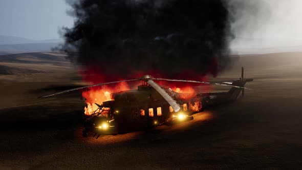 Burned Military Helicopter in the Desert at Sunset alt