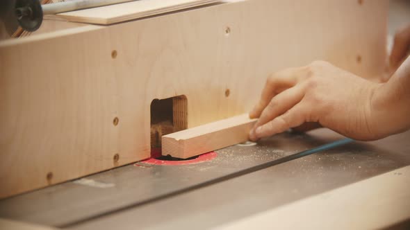 Carpentry Working - Hands of Man Worker Make a Hemisphere Cutout in the Plywood