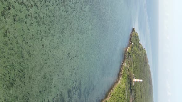 Vertical Video of the Ocean Near the Coast of Zanzibar Tanzania Aerial View