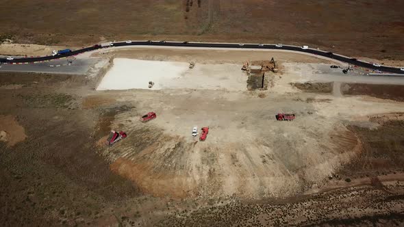 Aerial Road Constructions, Machinery and Mine Equipment Near Road on Sandy Surface