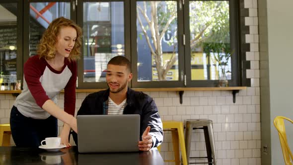 Executives discussing over laptop 4k