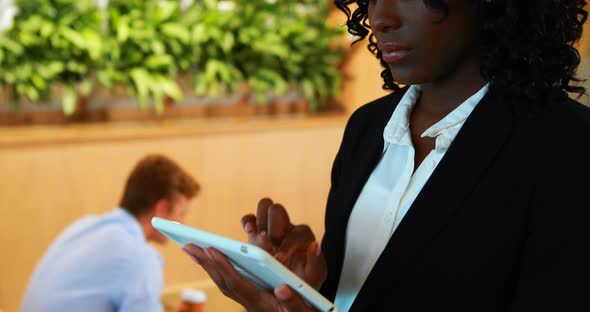 Businesswoman using digital tablet in office