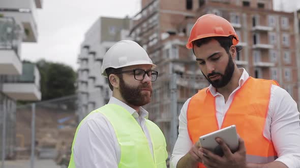 The Builder and Architect Man Are Discussing the Construction Plan of the Modern Business Center