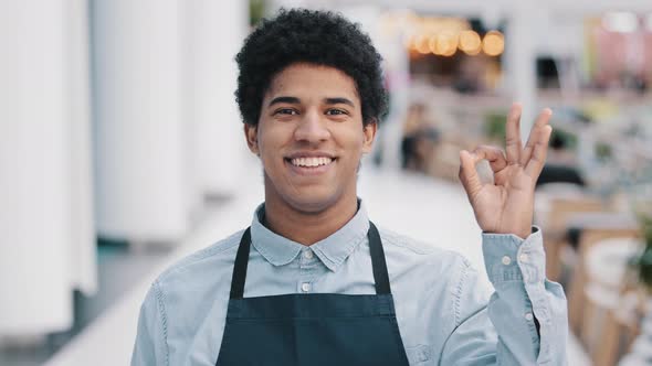 Young African American Male Worker Waiter Salesman in Apron Man Small Business Owner of Cafe