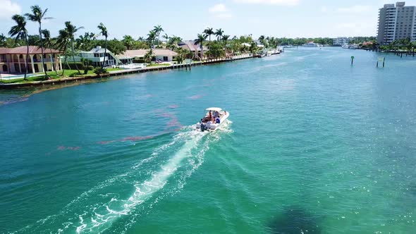 Awesome footage following a boat on an aqua marine blue-green Intracoastal waters.