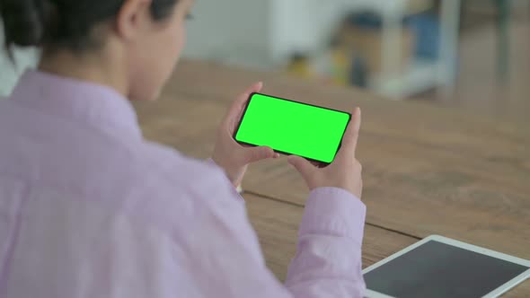 Indian Woman Looking at Smartphone with Chroma Screen