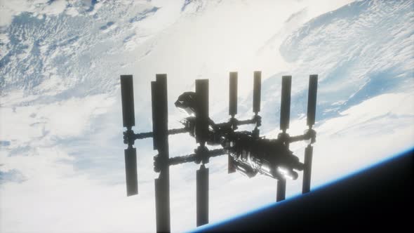 International Space Station in Outer Space Over the Planet Earth alt