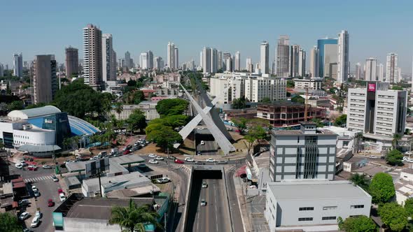 Aerial shot of the streets of Goiania in Brazil with many skyscrapers in the horizon.