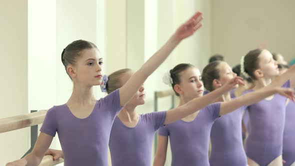 Training of Beautiful Ballet Dancers in Studio