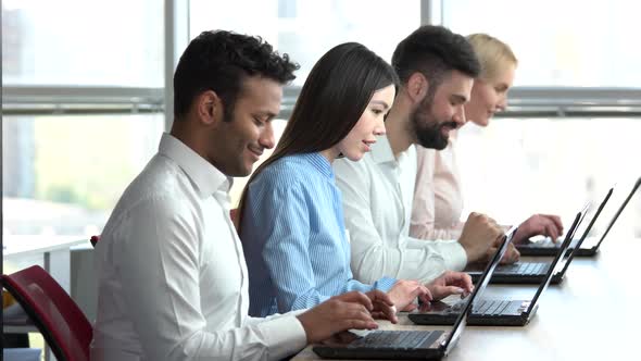 Smiling People Working Together in Office.