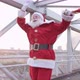 Santa Claus dancing on a pedestrian walkway. Merry Christmas. - VideoHive Item for Sale