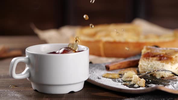 Sugar Cubes Falling Into Cup Near Pie